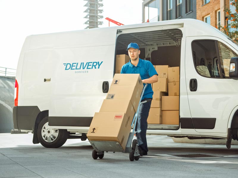 The man taking packages on dolly at Burnaby, BC.